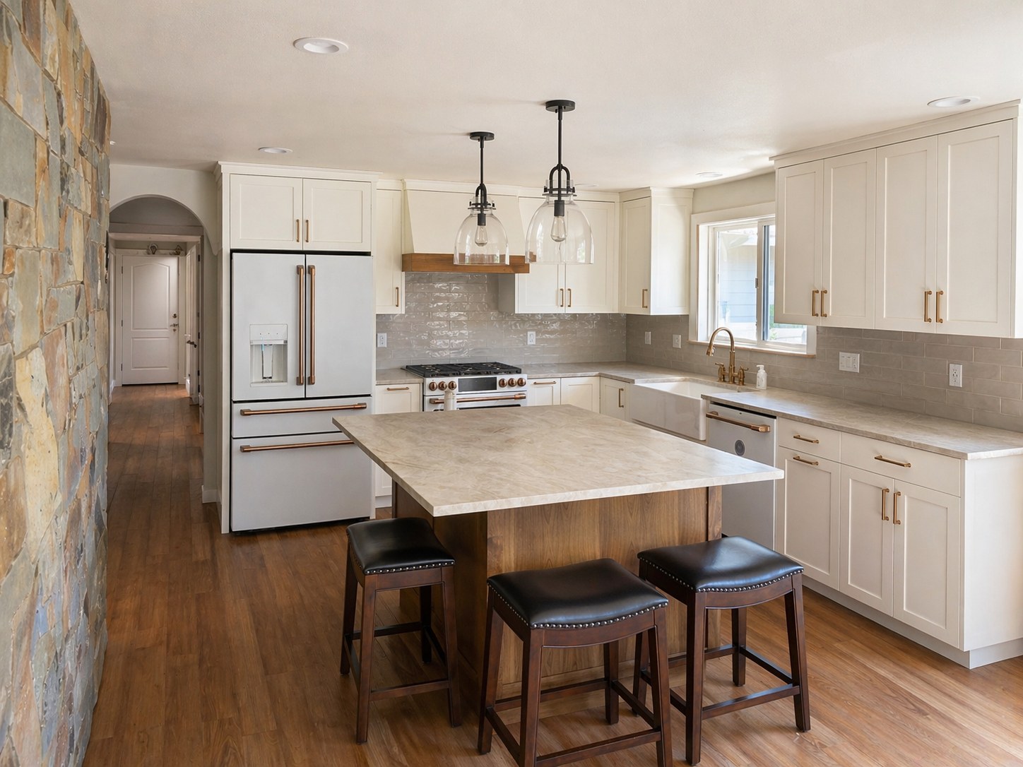 Full kitchen remodel with white shaker cabinets, brass hardware, Café appliances, marble island, walnut base, and zellige tile backsplash — Prineville Oregon