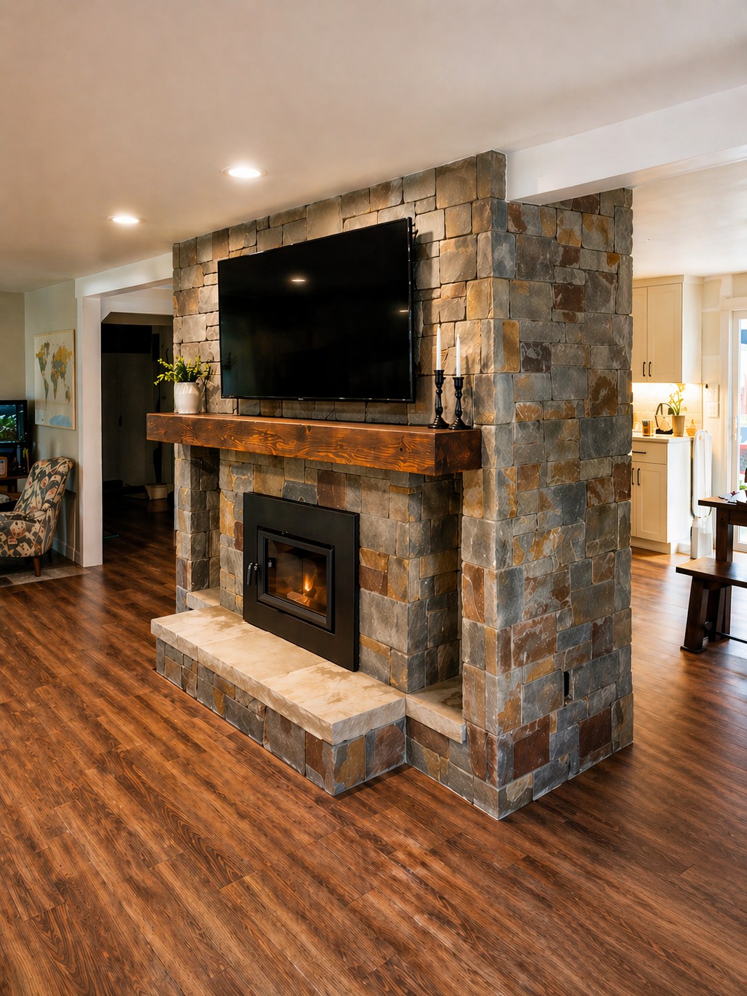 Rebuilt floor-to-ceiling stacked stone fireplace with gas insert and reclaimed wood beam mantel — Griffin Jr. Residence, Prineville Oregon